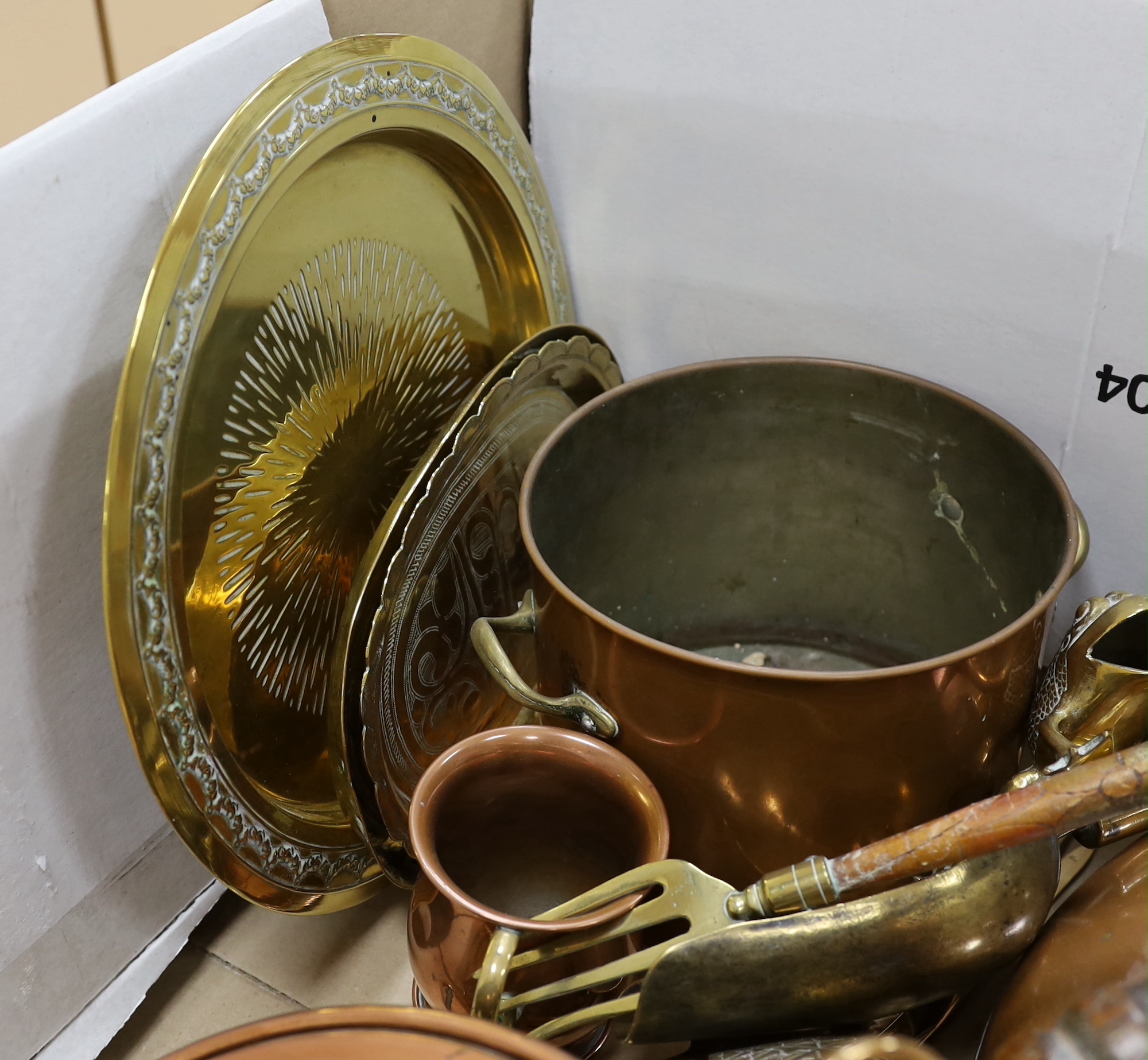 A group of mixed copper and brass including a warming pan, kettle, pot etc